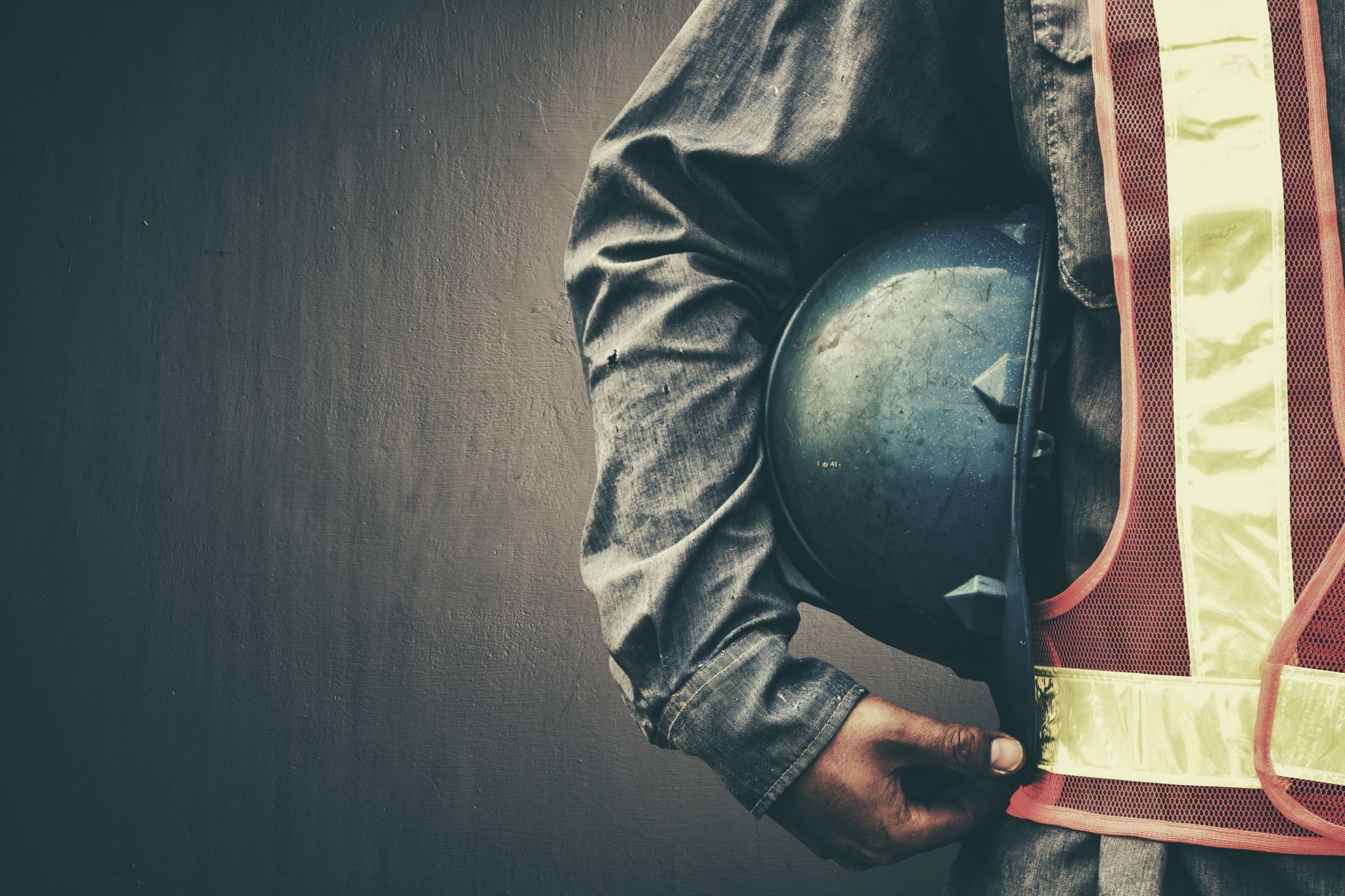 Worker-holding-safety-helmet